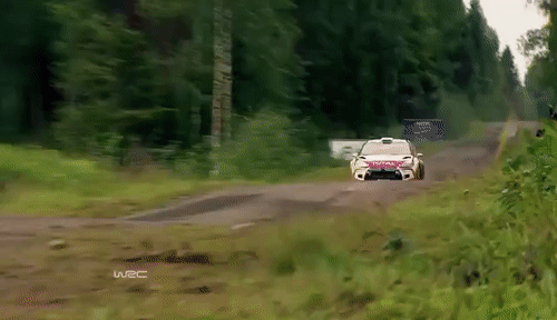 A car moving fast in the woods